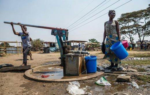 Working class residents like these in the Harare suburb of Glen View rely on water pumped from a boreholes drilled by a donor or city authorities