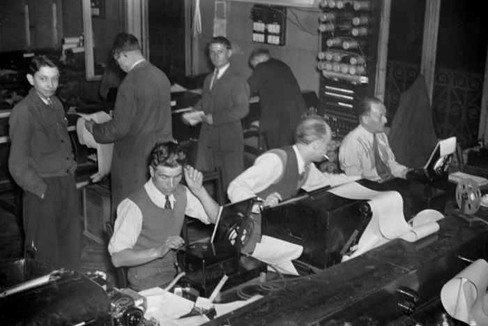 Journalists at work at AFP in 1946, two years after it was reclaimed from the pro-Nazi regime during the uprising that liberated Paris from German occupation