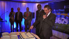 File image of Sportpesa CEO Ronald Karauri flanked by other guests at a past function