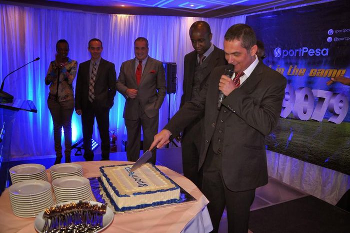 File image of Sportpesa CEO Ronald Karauri flanked by other guests at a past function