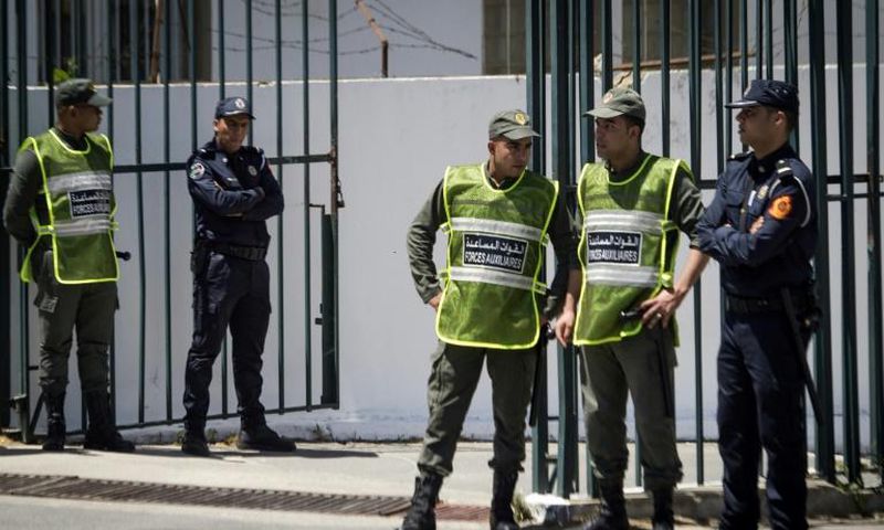 Moroccan security forces standing guard during Thursday's trial in Sale, near Rabat