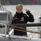 Swedish climate activist Greta Thunberg waves from aboard the Malizia II IMOCA class sailing yacht which is taking her to New York