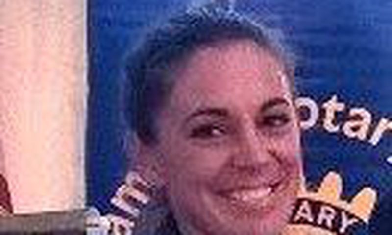 Police officer hired hit man to kill her husband and a young girl, officials say