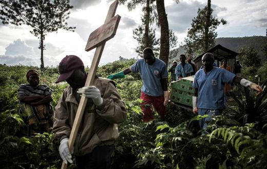 An Ebola victim is buried in Butembo, eastern DR Congo. More than 2,100 people have died in the 14-month-old epidemic