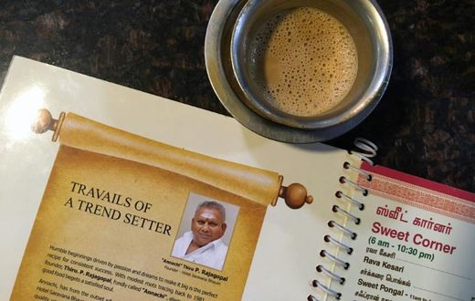 An image of "Dosa King" P. Rajagopal is printed on the menu at one of his restaurants in Chennai, India