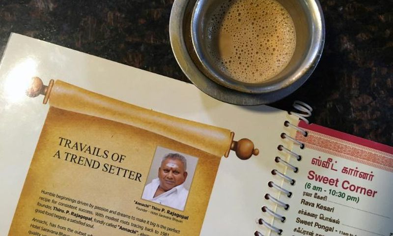 An image of "Dosa King" P. Rajagopal is printed on the menu at one of his restaurants in Chennai, India