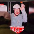 People watch a television news report in a Seoul railway station on the death of Kim Jong-Nam, the half-brother of North Korean leader