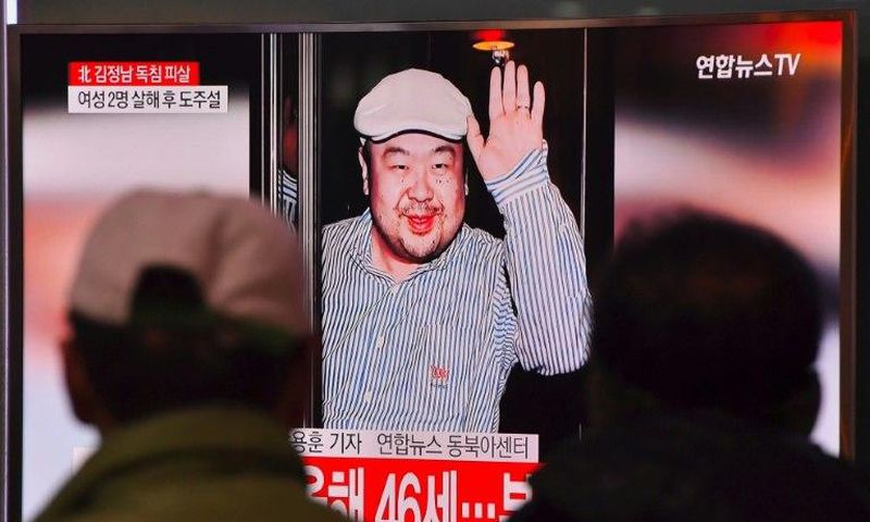 People watch a television news report in a Seoul railway station on the death of Kim Jong-Nam, the half-brother of North Korean leader