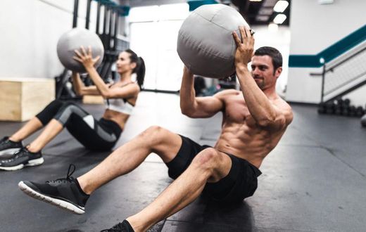 Grab a Partner and a Med Ball to Smash Your Abs