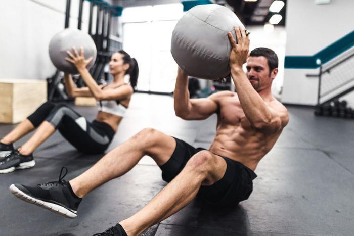 Grab a Partner and a Med Ball to Smash Your Abs