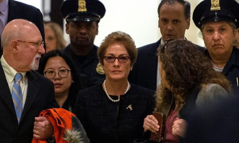 Former US ambassador to Ukraine Marie Yovanovitch (C) arrives for a closed-doors deposition before House committees leading the impeachment investigation of President Donald Trump, on October 11, 2019