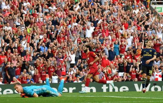 Streaking clear: Mohamed Salah (centre) scored twice in Liverpool's win over Arsenal