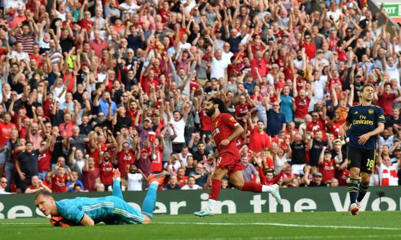 Streaking clear: Mohamed Salah (centre) scored twice in Liverpool's win over Arsenal