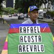 An opposition activist carries a kite with the name of recently deceased navy captain Rafael Acosta in Caracas: the US said it will impose snactions on the intelligence agency accused or torturing him to death