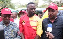 McDonald Mariga (Center) flanked by Woodley MCA Abraham Mwangi (left) and Langata MP Nickson Korir addressing the media on October 12 at Yaya Centre in Nairobi