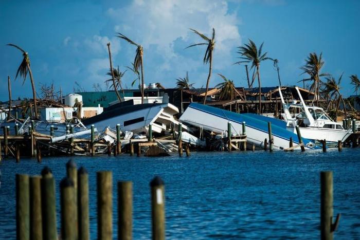 Destroyed boats are pushed up against the pier in the aftermath of Hurricane Dorian in Treasure Cay on Abaco Island, Bahamas