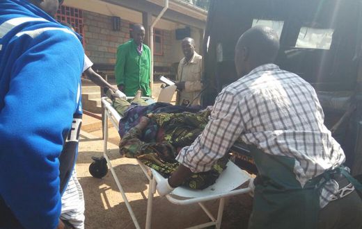 File image of a casualty being led out of a crime scene. 2 people suffer serious injuries after chang'aa boiler exploded in Machakos