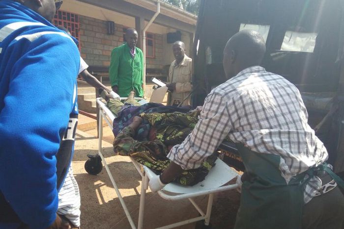 File image of a casualty being led out of a crime scene. 2 people suffer serious injuries after chang'aa boiler exploded in Machakos