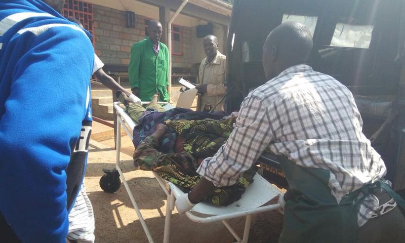 File image of a casualty being led out of a crime scene. 2 people suffer serious injuries after chang'aa boiler exploded in Machakos