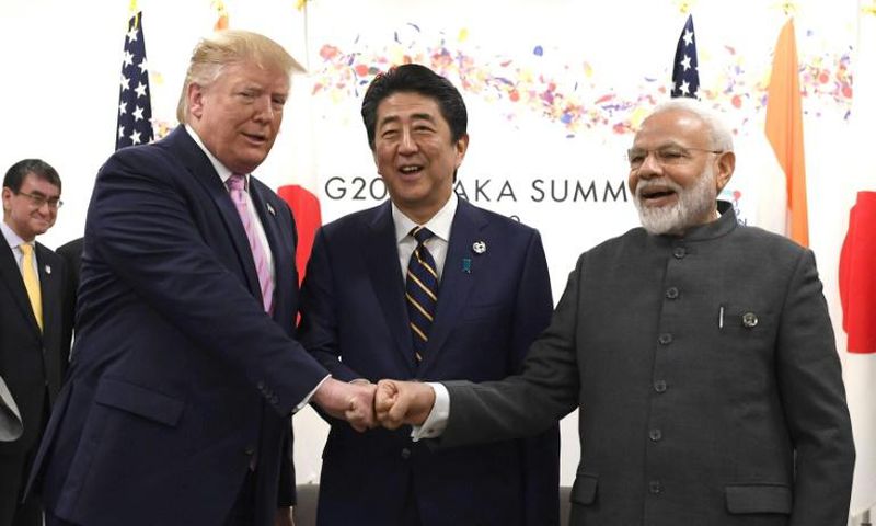 President Donald Trump opted for a jovial fist bump with Japanese Prime Minister Shinzo Abe and India's Narendra Modi