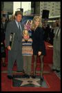 Farrah Fawcett, Ryan ONeal, and their son Redmond ONeal at ceremony honoring Farrah into Hollywoods Walk of Fame.