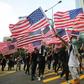 Many of those marching waved American flags