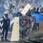Demonstrators in Ecuador clash with riot police during a protest over a fuel price hike ordered by the government to secure an IMF loan