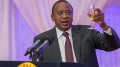 President Uhuru Kenyatta toasting to happy life at a past event.