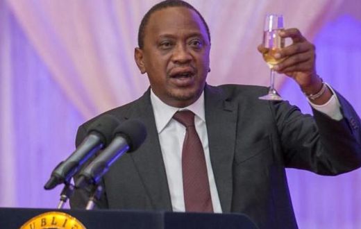 President Uhuru Kenyatta toasting to happy life at a past event.