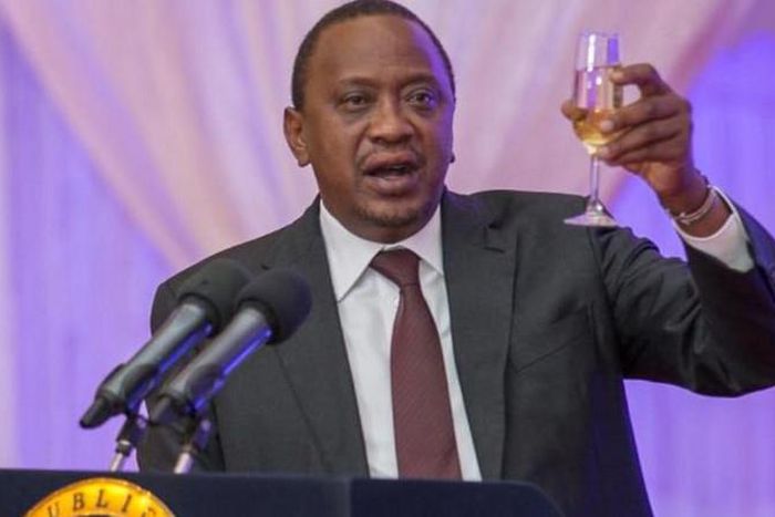President Uhuru Kenyatta toasting to happy life at a past event.