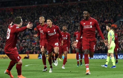 Liverpool's Divock Origi (R) celebrates after scoring against Barcelona