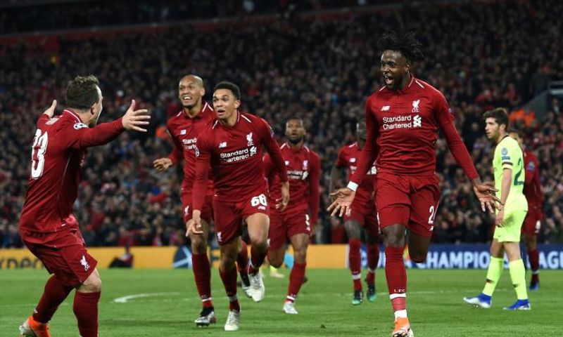 Liverpool's Divock Origi (R) celebrates after scoring against Barcelona