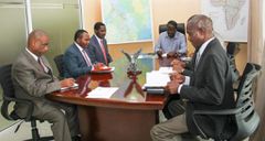 Trade CS Peter Munya receives advise from Raila Odinga during meeting at Capitol Hill