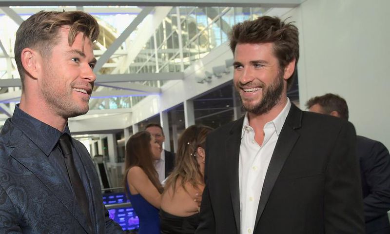 Chris & Liam Hemsworth Get Competitive Working Out