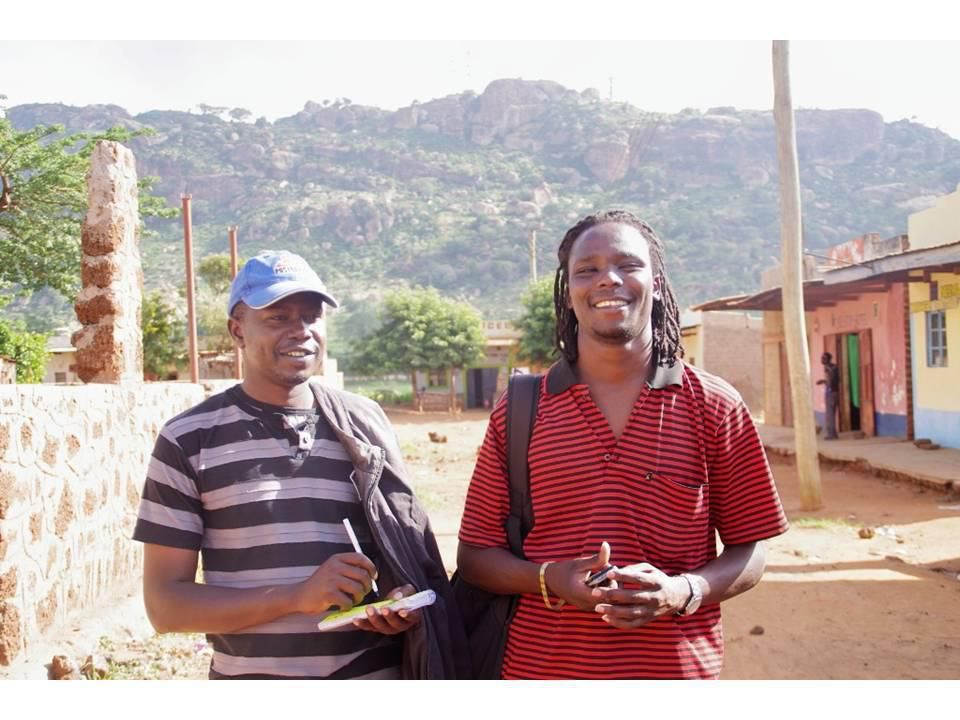 KBC journalist Jonathan Muendo (in red stripped t-shirt) with a colleague (Facebook)