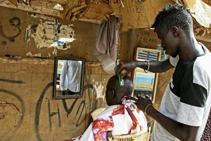 Young men are flocking to barbershops in Khartoum for modern hairstyles once banned under Omar al-Bashir's regime