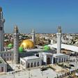 The huge Massalikul Mosque has risen from swampy land in the rundown district of Bopp