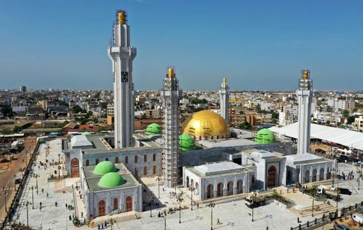 The huge Massalikul Mosque has risen from swampy land in the rundown district of Bopp
