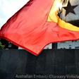An East Timorese student waves his national flag during a 2016 protest about Australia's intentions in the Timor Sea
