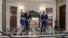 NATO's General Secretary Jens Stoltenberg (L) speaks next to Greek Prime Minister Kyriakos Mitsotakis during a press conference after their meeting in Athens on October 10, 2019