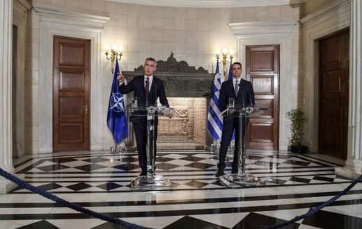 NATO's General Secretary Jens Stoltenberg (L) speaks next to Greek Prime Minister Kyriakos Mitsotakis during a press conference after their meeting in Athens on October 10, 2019