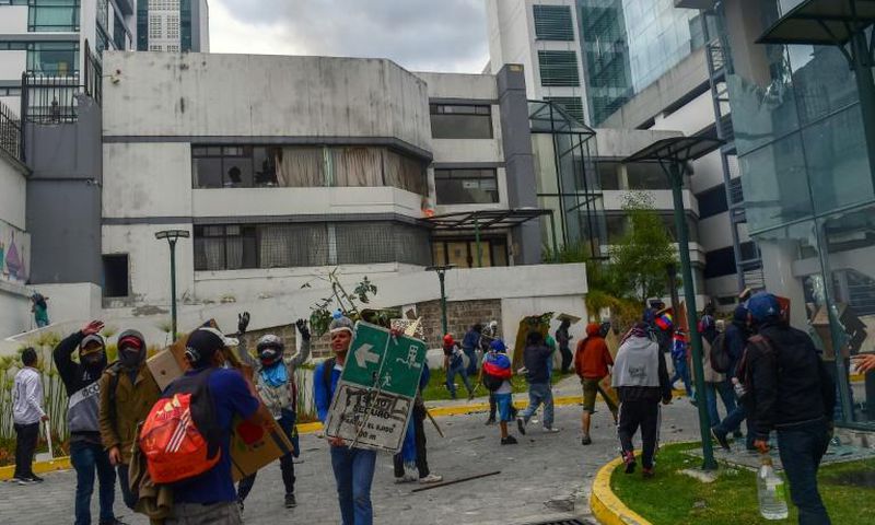 Demonstrators break into the General Comptrollers Office building during the 10th day of protests over a fuel price hike ordered by the government to secure an IMF loan