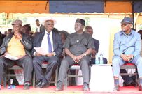 Raila Odinga flanked by other leaders during the burial of Dr David Ombati in Kisii yesterday