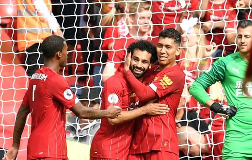 Roberto Firmino (right) teed up Mohamed Salah (centre) for Liverpool's third goal against Newcastle