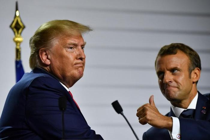 US President Donald Trump (L) and French President Emmanuel Macron unveiled an agreement allowing France's digital tax to remain in place until a new global taxation plan takes effect