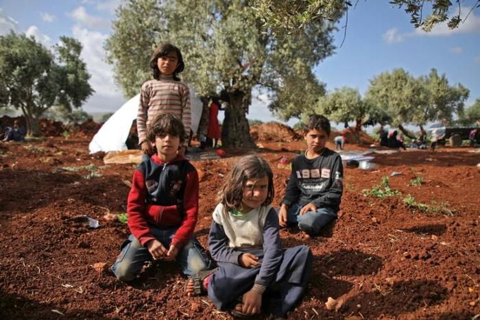 Dozens of families have set up camp in the fields of Atme