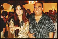 Ali Punjani (Right) in a stripped shirt