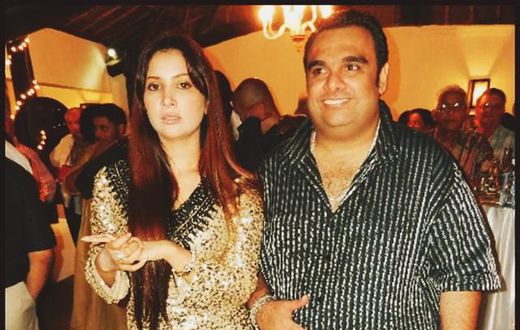 Ali Punjani (Right) in a stripped shirt