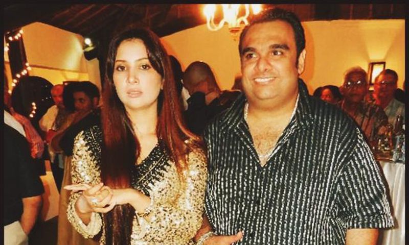 Ali Punjani (Right) in a stripped shirt