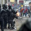 Demonstrators clash with riot police as thousands march against Ecuadorean President Lenin Moreno's decision to slash fuel subsidies, in Quito on October 9, 2019